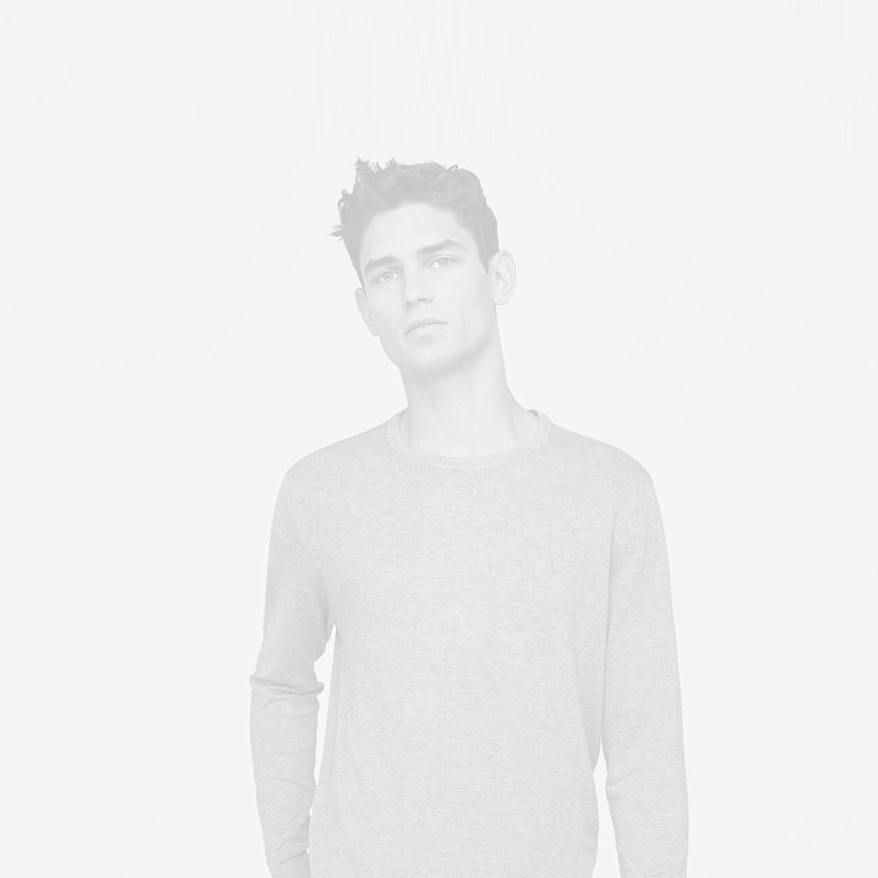 Young man standing outdoors, promoting wellness and relaxation at Coastline Wellness.