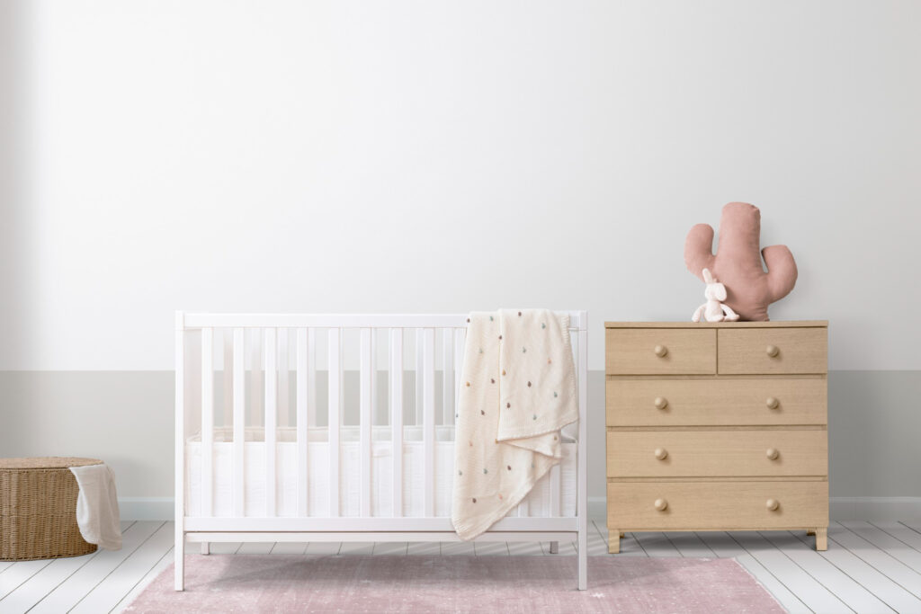 Minimalist nursery with crib and dresser